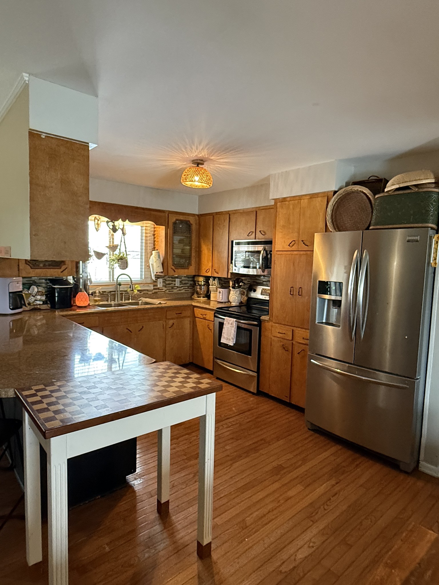 1503 Frances Street Lawrenceburg, TN 38464 - Photo 22 of 44 a kitchen with kitchen island a counter top space cabinets and stainless steel appliances