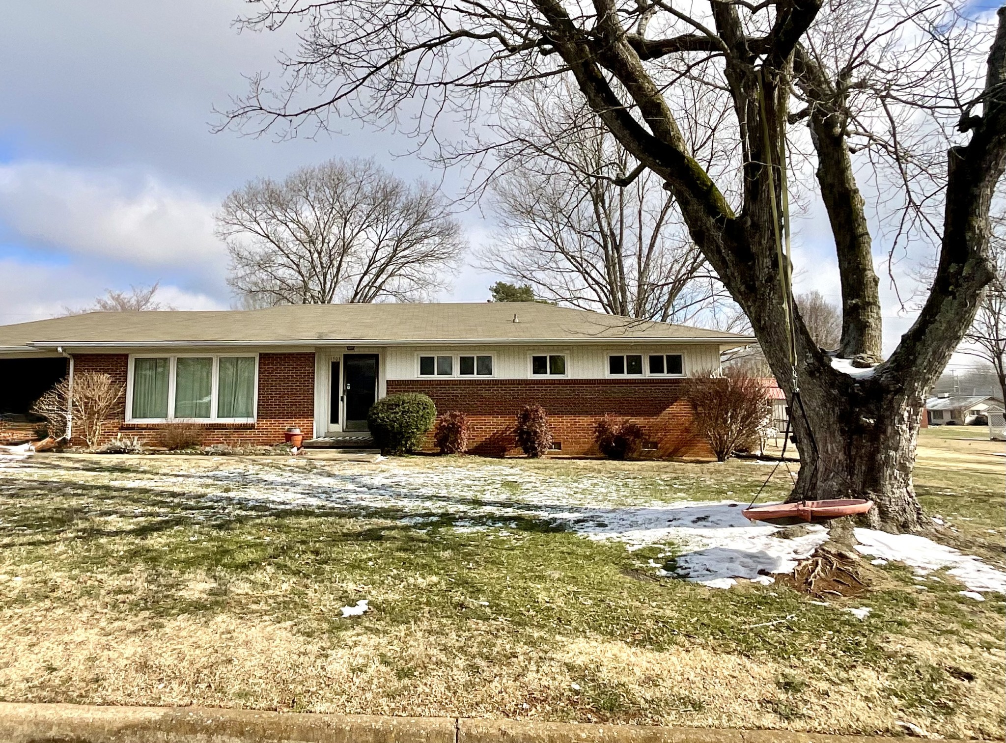 1503 Frances Street Lawrenceburg, TN 38464 - Photo 3 of 44 a view of a house with snow in the background