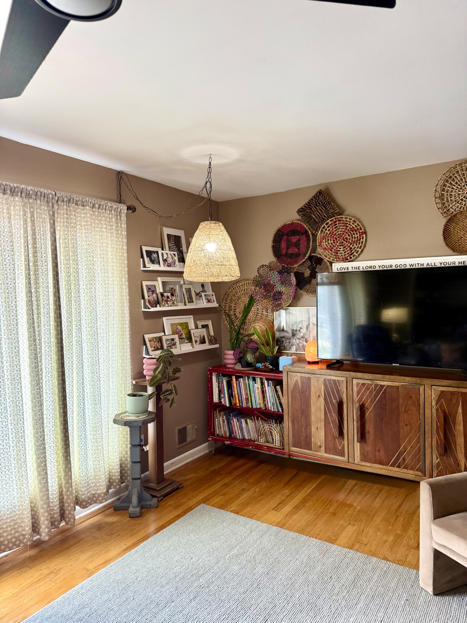 1503 Frances Street Lawrenceburg, TN 38464 - Photo 8 of 44 a living room with furniture a flat screen tv and gym equipment