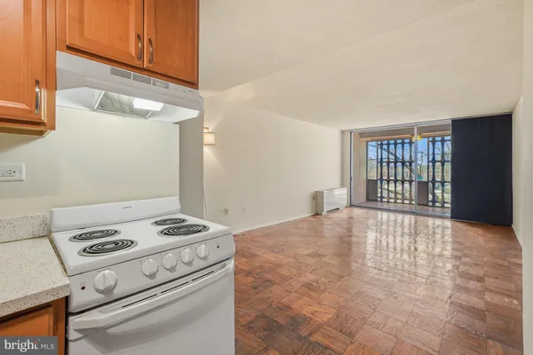 a view of kitchen and wooden floor