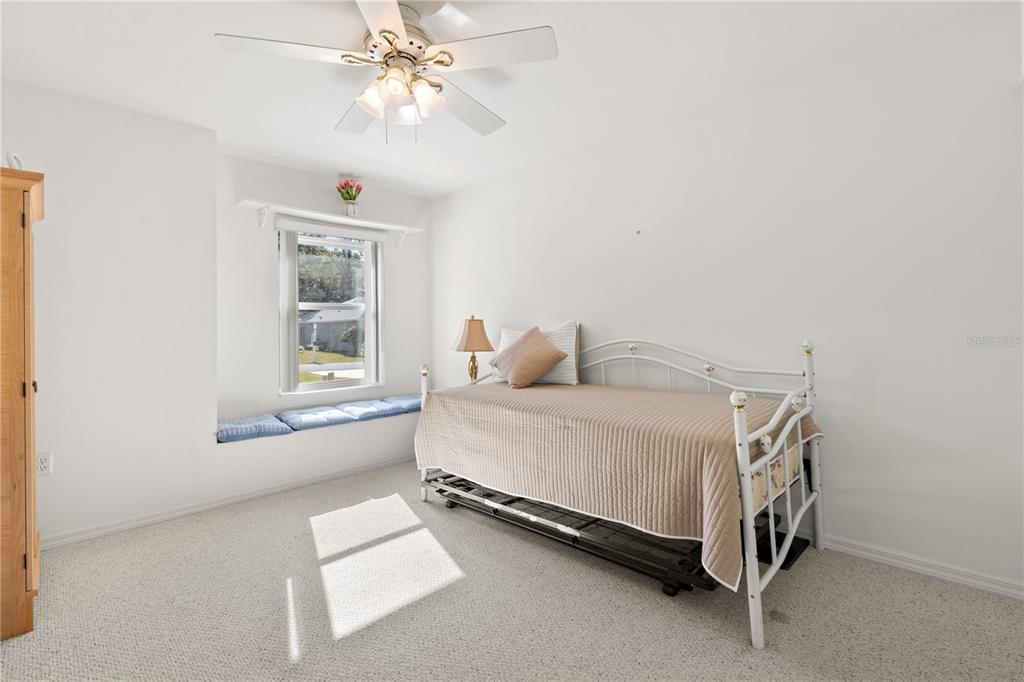 11287 Southwest 73rd Circle Ocala, FL 34476 - Photo 17 of 37 a bedroom with a bed and window