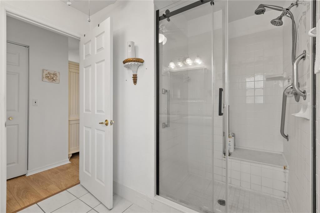 11287 Southwest 73rd Circle Ocala, FL 34476 - Photo 21 of 37 a bathroom with a glass shower door