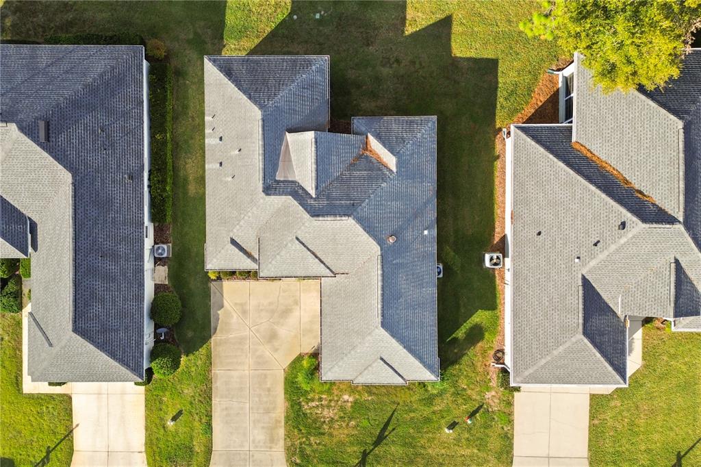 11287 Southwest 73rd Circle Ocala, FL 34476 - Photo 31 of 37 an aerial view of a house with a yard and a garage