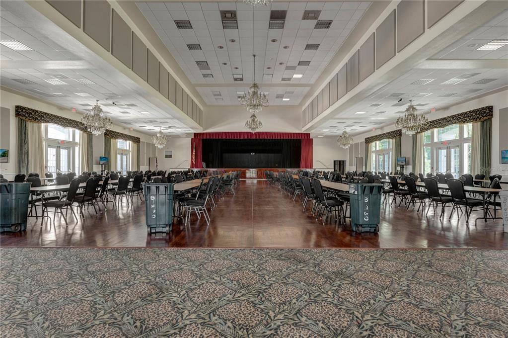 11287 Southwest 73rd Circle Ocala, FL 34476 - Photo 33 of 37 a room with lots of dining table chairs and a chandelier