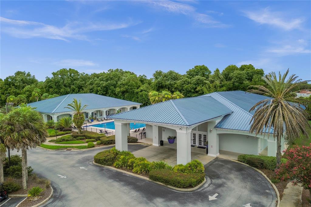 11287 Southwest 73rd Circle Ocala, FL 34476 - Photo 35 of 37 a front view of a house with a garden