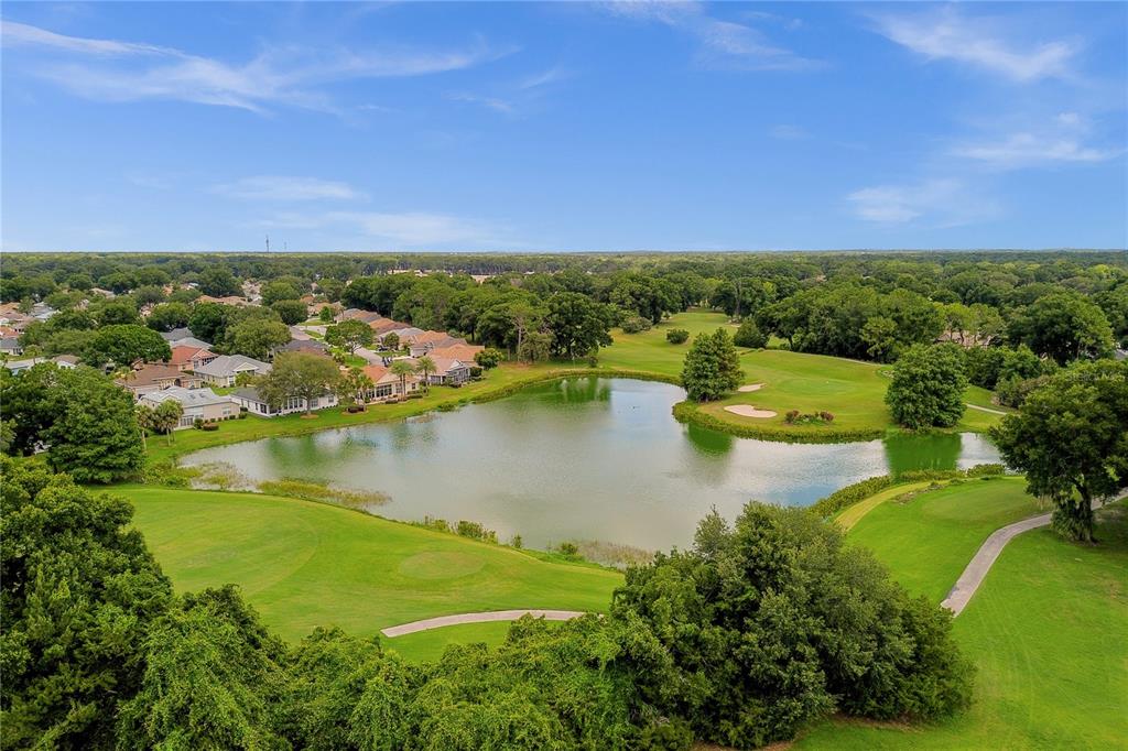 11287 Southwest 73rd Circle Ocala, FL 34476 - Photo 36 of 37 a view of a lake with a houses