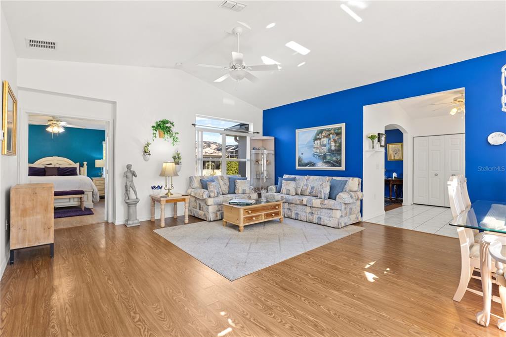11287 Southwest 73rd Circle Ocala, FL 34476 - Photo 4 of 37 a living room with furniture and wooden floor