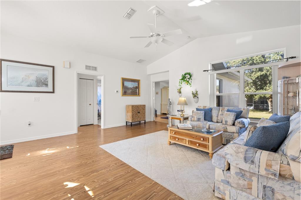 11287 Southwest 73rd Circle Ocala, FL 34476 - Photo 5 of 37 a living room with furniture and a large window