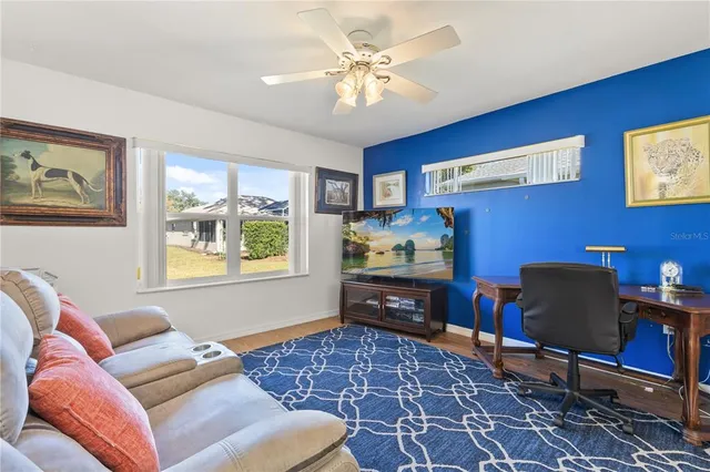 a living room with furniture and a window