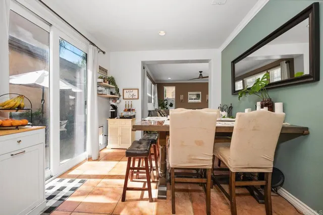 a view of a dining room with furniture and a livingroom