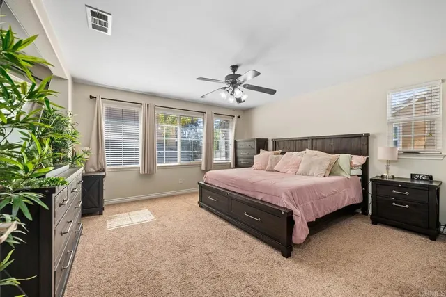 a large bathroom with a granite countertop sink mirror and shower