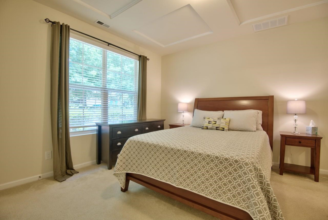 Undisclosed Address Durham, NC 27705 - Photo 14 of 25 a bedroom with a bed and a window