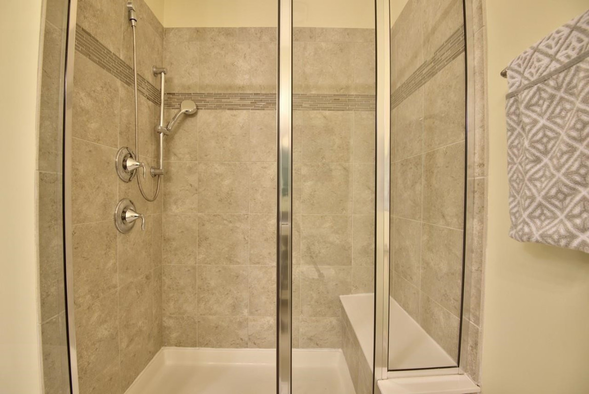 Undisclosed Address Durham, NC 27705 - Photo 17 of 25 a bathroom with a glass shower door