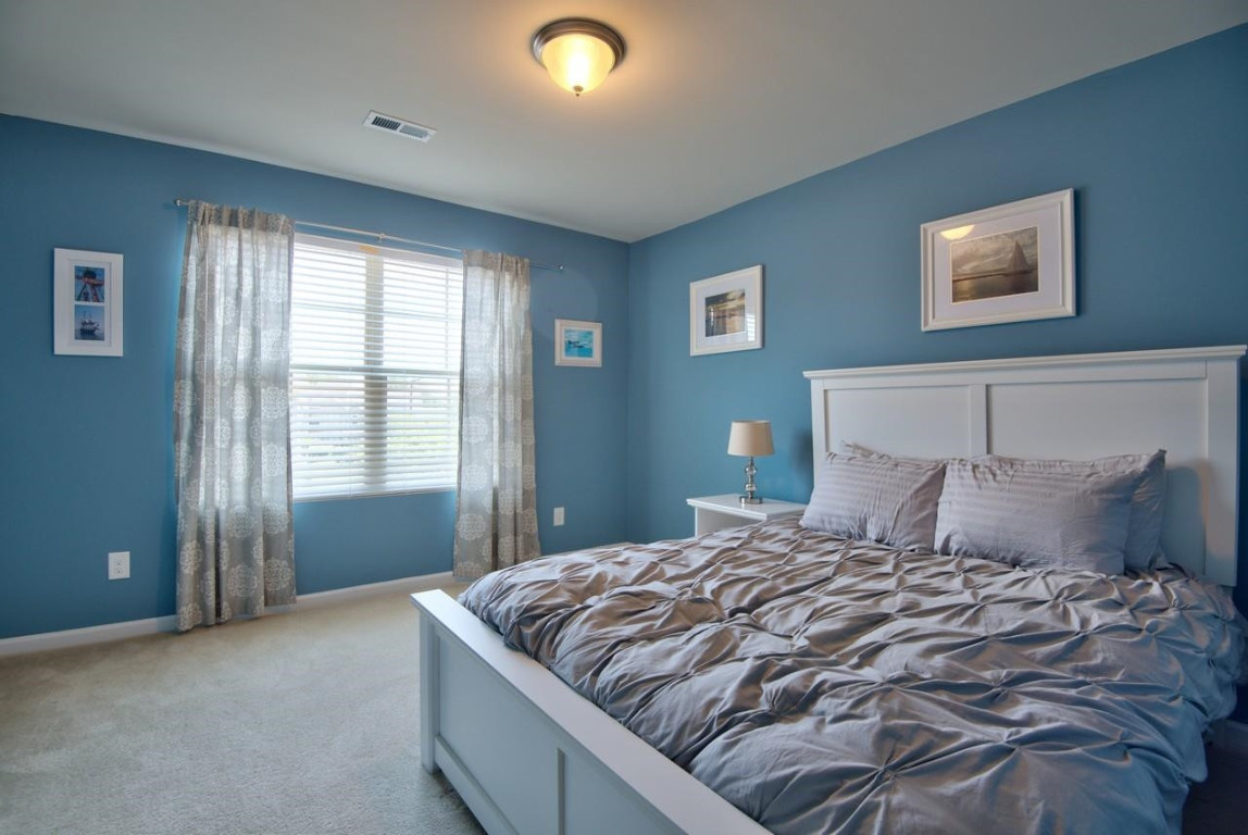 Undisclosed Address Durham, NC 27705 - Photo 21 of 25 a bedroom with a large bed and a large window