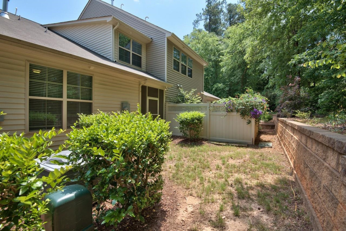 Undisclosed Address Durham, NC 27705 - Photo 24 of 25 a view of a backyard with plants and large tree