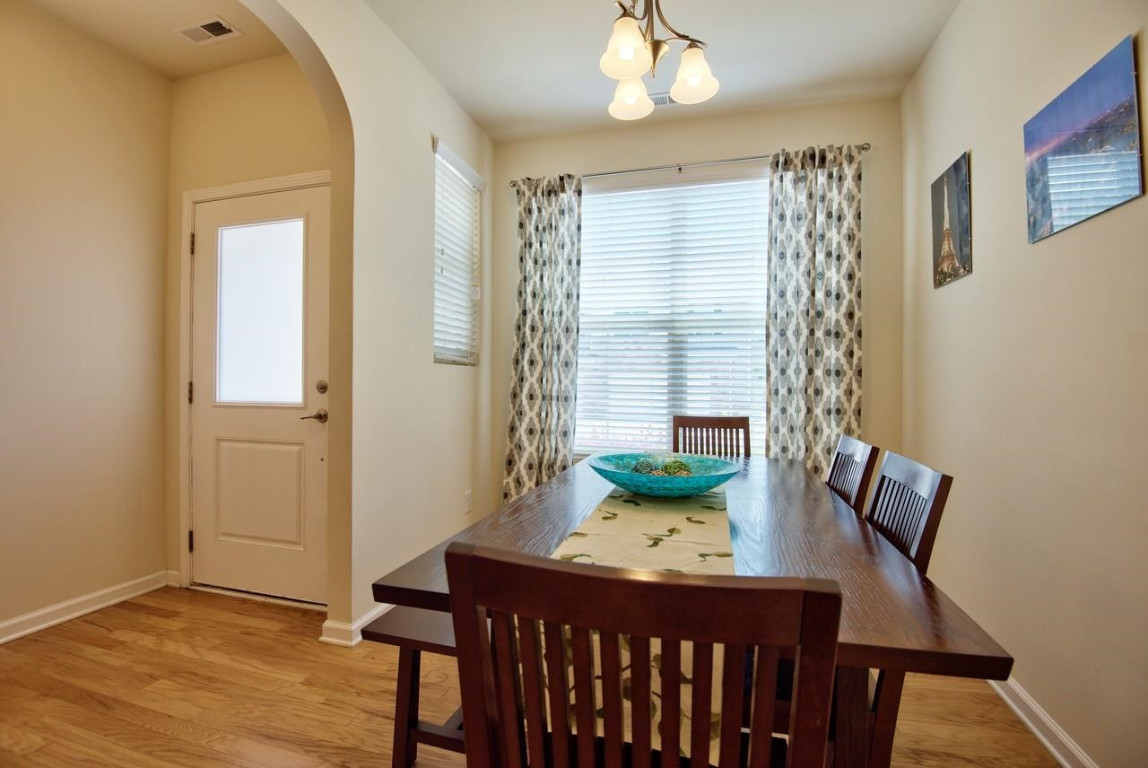 Undisclosed Address Durham, NC 27705 - Photo 3 of 25 a view of a dining room with furniture and wooden floor