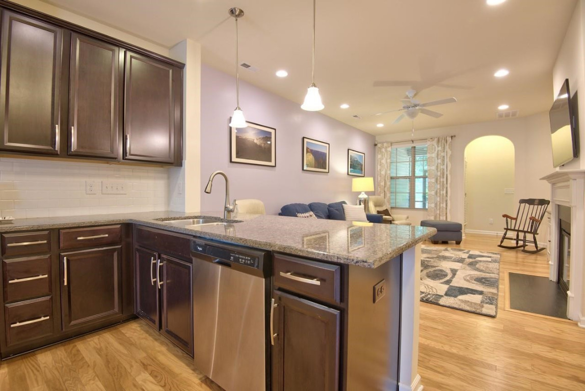 Undisclosed Address Durham, NC 27705 - Photo 8 of 25 a kitchen with a sink and cabinets