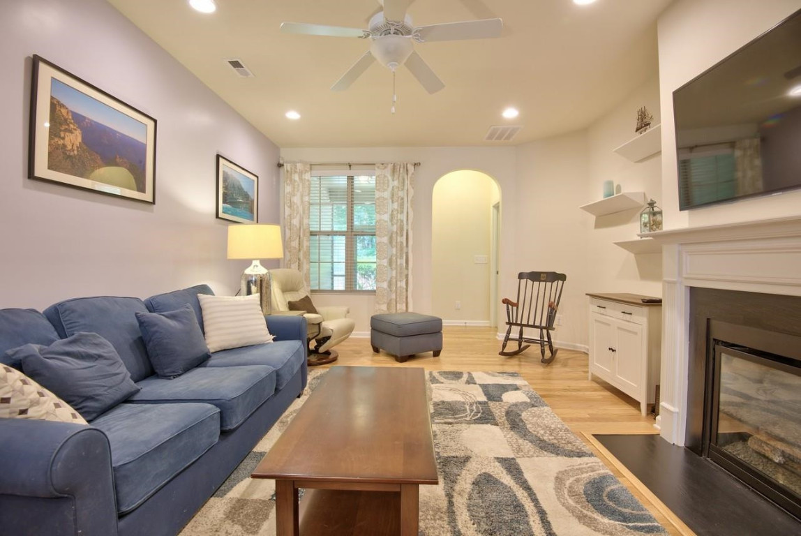 Undisclosed Address Durham, NC 27705 - Photo 9 of 25 a living room with furniture fireplace and a flat screen tv