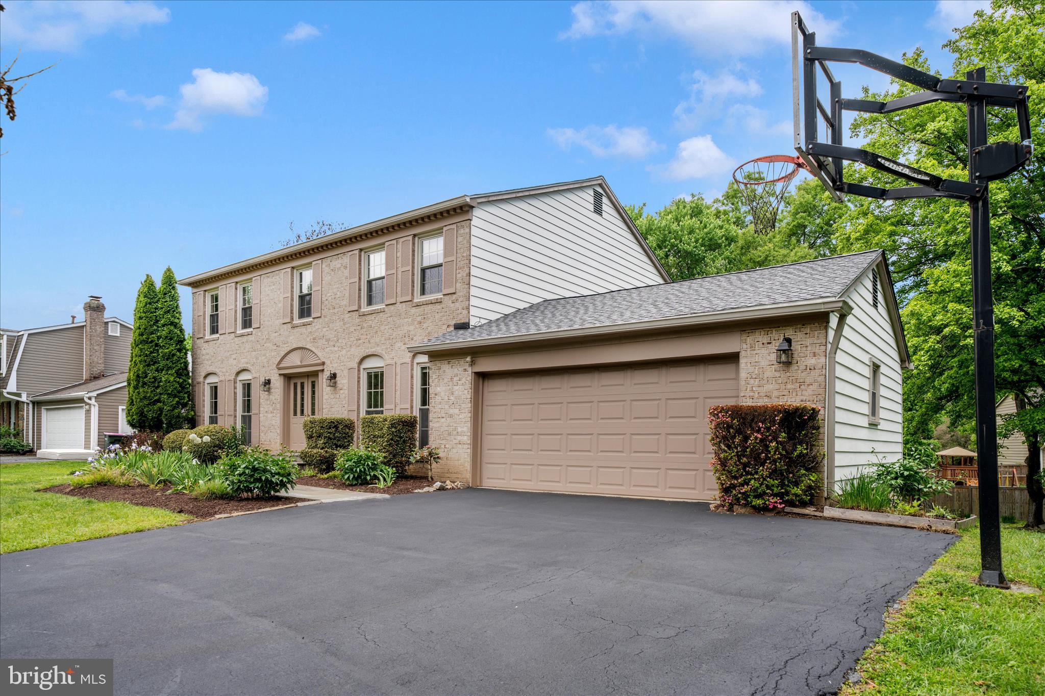 16000 Narrows Terrace Silver Spring, MD 20906 - Photo 53 of 54 a front view of a house with a yard and garage