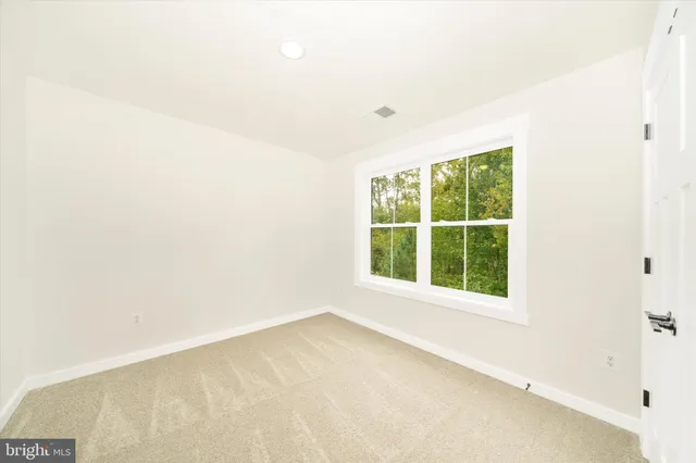 a view of a house with a tree