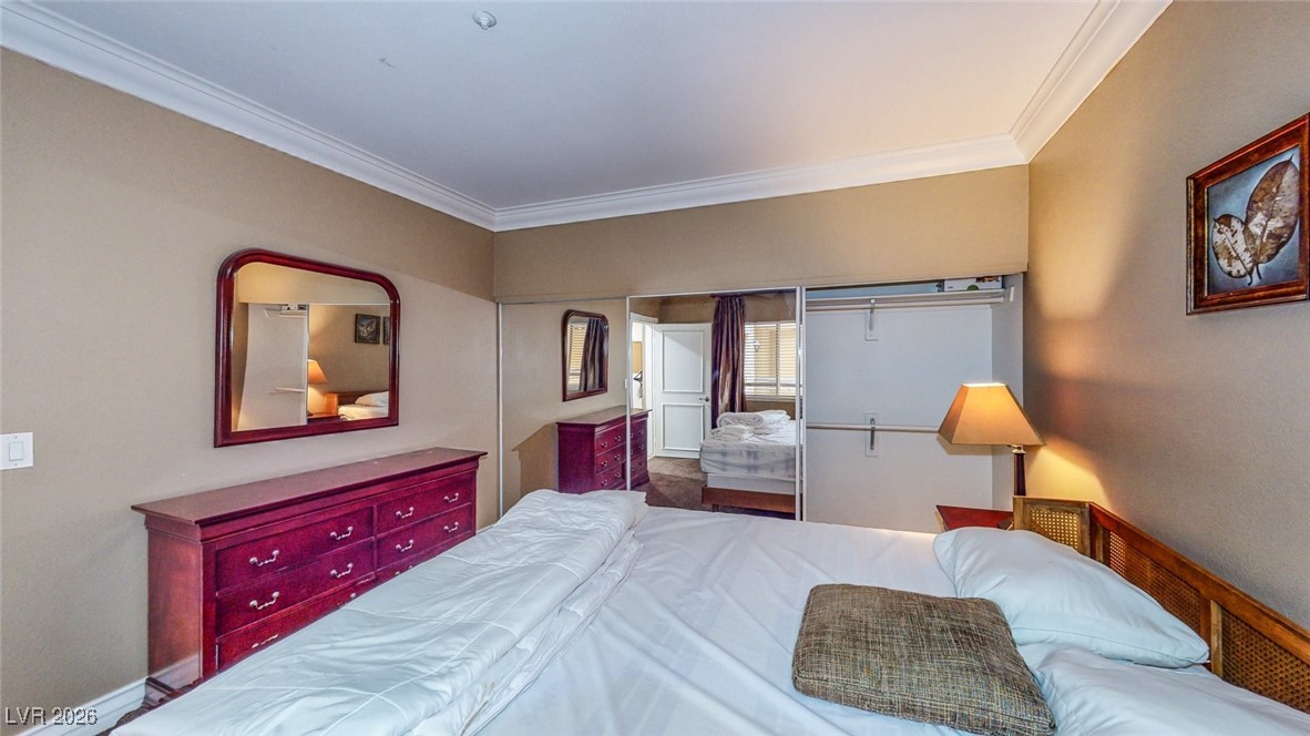 260 East Flamingo Road, Unit 229 Las Vegas, NV 89169 - Photo 16 of 31 Bedroom featuring crown molding