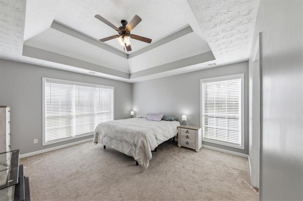 493 Youth Jersey Road Covington, GA 30014 - Photo 26 of 52 a bed room with a bed and a window