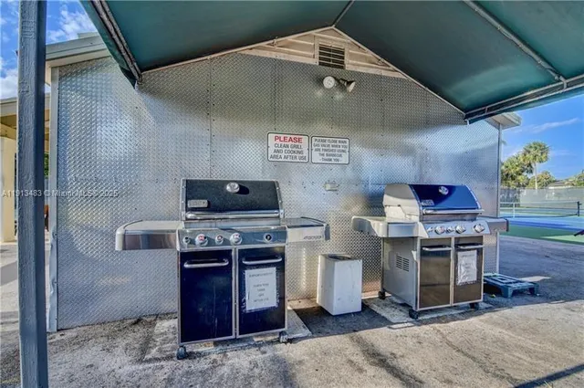a kitchen with stainless steel appliances granite countertop a stove and a sink