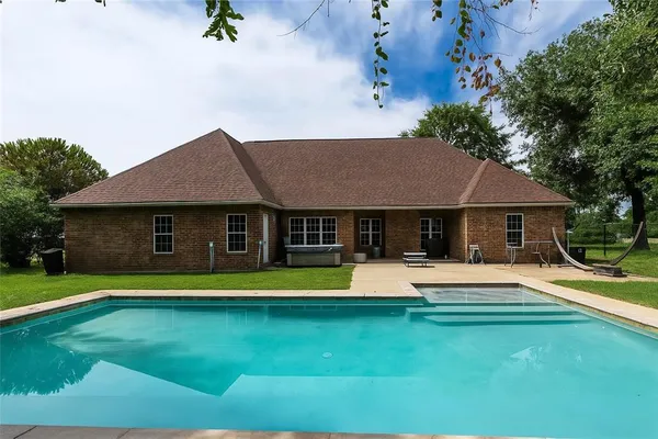 a view of a house with a swimming pool