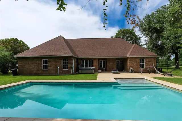a view of a house with a swimming pool