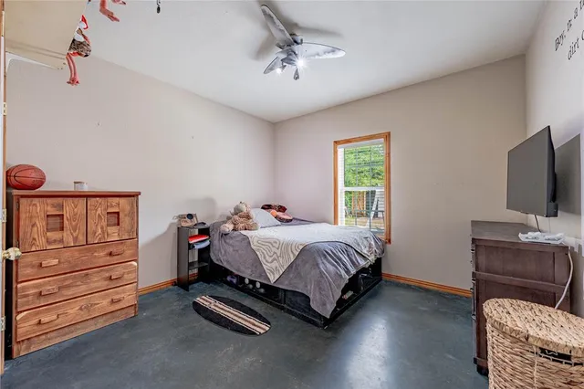 a bedroom with a bed and furniture