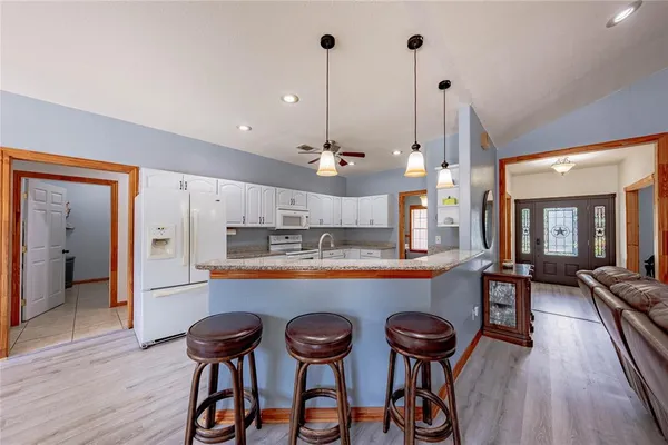 a kitchen with a table and chairs in it