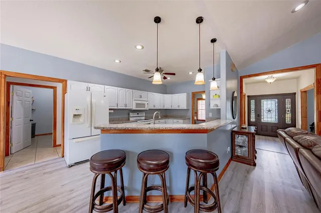 a kitchen with a table and chairs in it