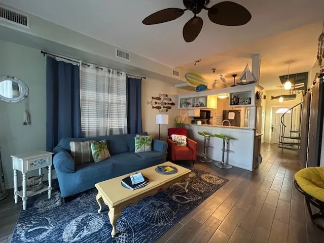 a living room with furniture and a rug