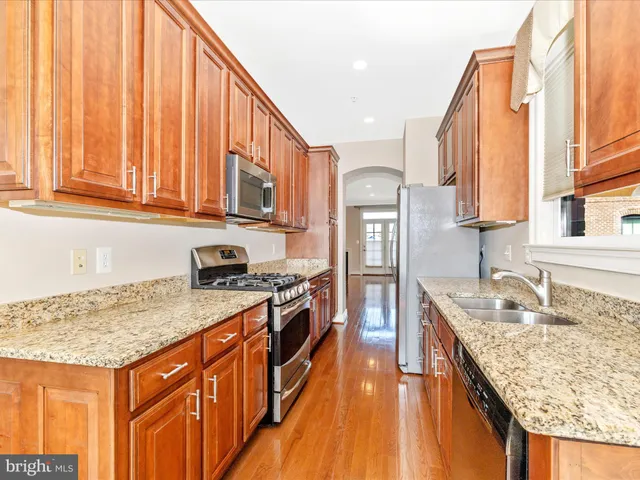 a view of a livingroom with a ceiling fan and window