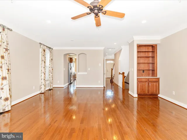 a kitchen with granite countertop a sink a stove and cabinets