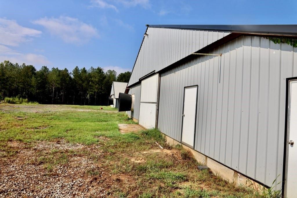 993 Sexton Road Resaca, GA 30735 - Photo 12 of 24 a backyard of a house with lots of green space