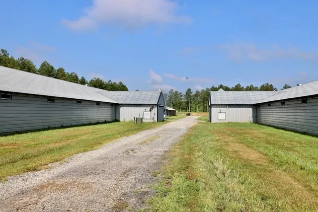 a view of a house with a yard and garage