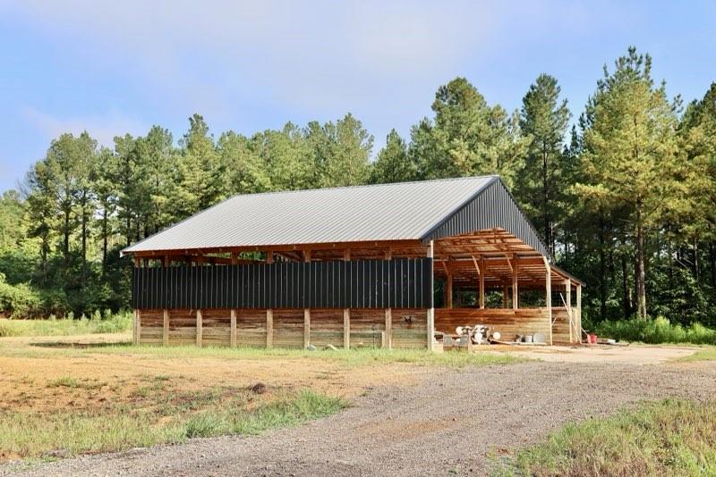 993 Sexton Road Resaca, GA 30735 - Photo 15 of 24 a front view of a house with a yard garage and outdoor seating