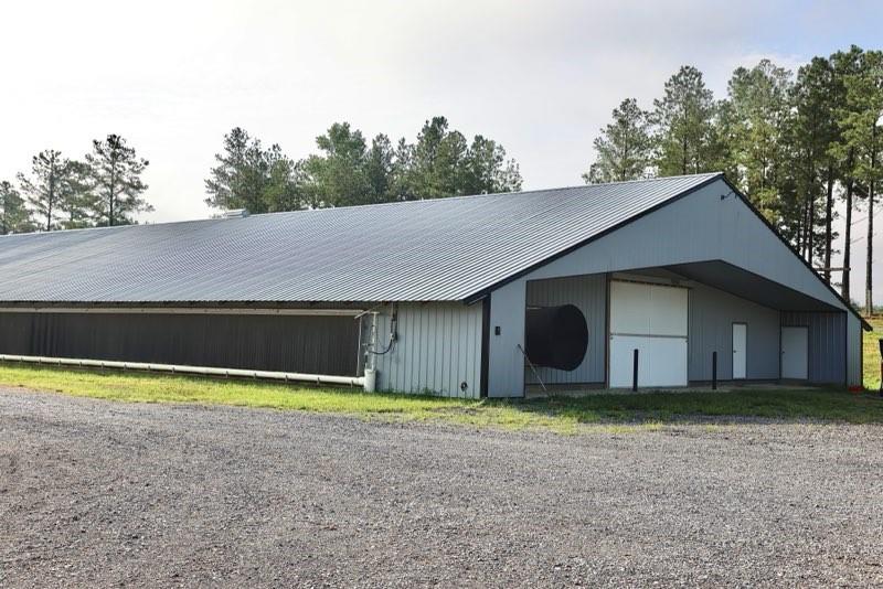 993 Sexton Road Resaca, GA 30735 - Photo 3 of 24 a view of a house with a yard and garage