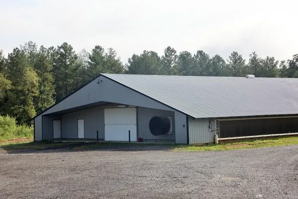 a house with trees in the background