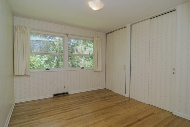 41-w393 Farview Road Elburn, IL 60119 - Photo 13 of 24 a view of an empty room with wooden floor and a window
