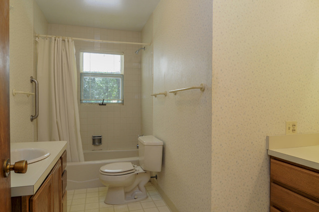 41-w393 Farview Road Elburn, IL 60119 - Photo 14 of 24 a bathroom with a granite countertop toilet a sink and a shower