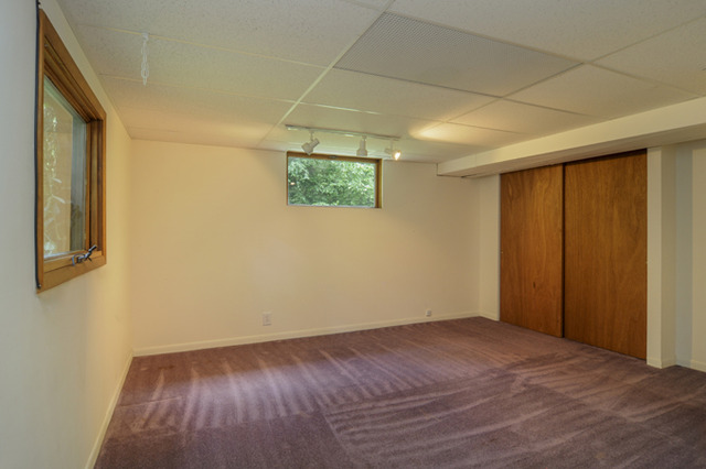 41-w393 Farview Road Elburn, IL 60119 - Photo 15 of 24 a view of an empty room with wooden floor and a window