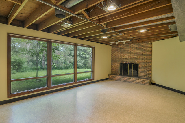41-w393 Farview Road Elburn, IL 60119 - Photo 17 of 24 a view of empty room with floor to ceiling window and fireplace