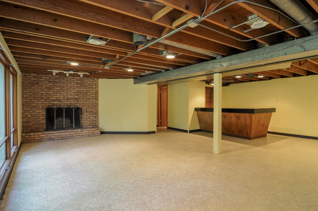 41-w393 Farview Road Elburn, IL 60119 - Photo 18 of 24 a view of an empty room with a fireplace