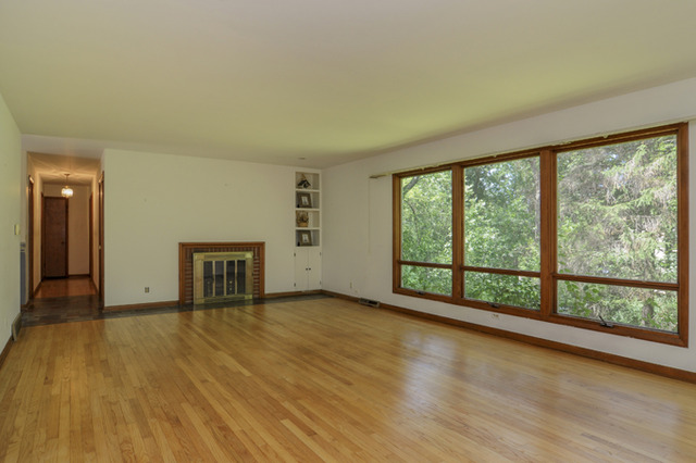 41-w393 Farview Road Elburn, IL 60119 - Photo 6 of 24 a view of an empty room with glass door and a window