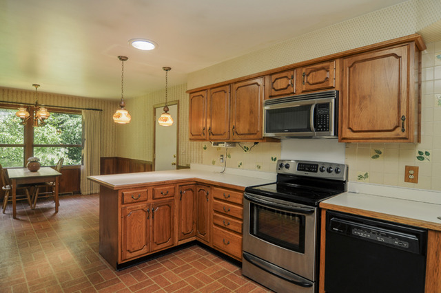 41-w393 Farview Road Elburn, IL 60119 - Photo 8 of 24 a kitchen with a sink stove and microwave