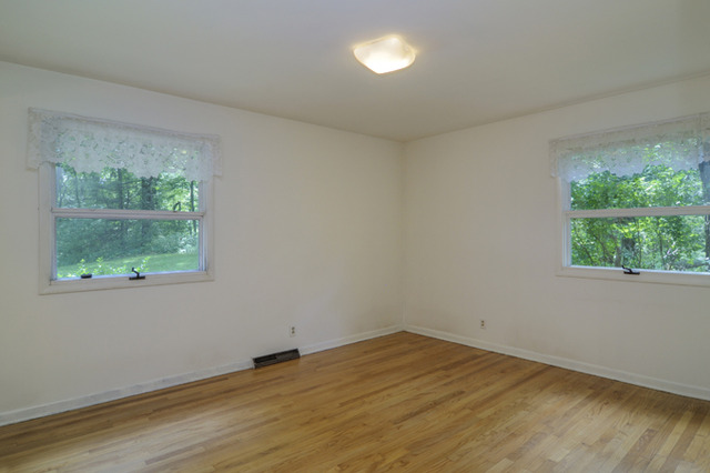 41-w393 Farview Road Elburn, IL 60119 - Photo 10 of 24 an empty room with wooden floor and a window