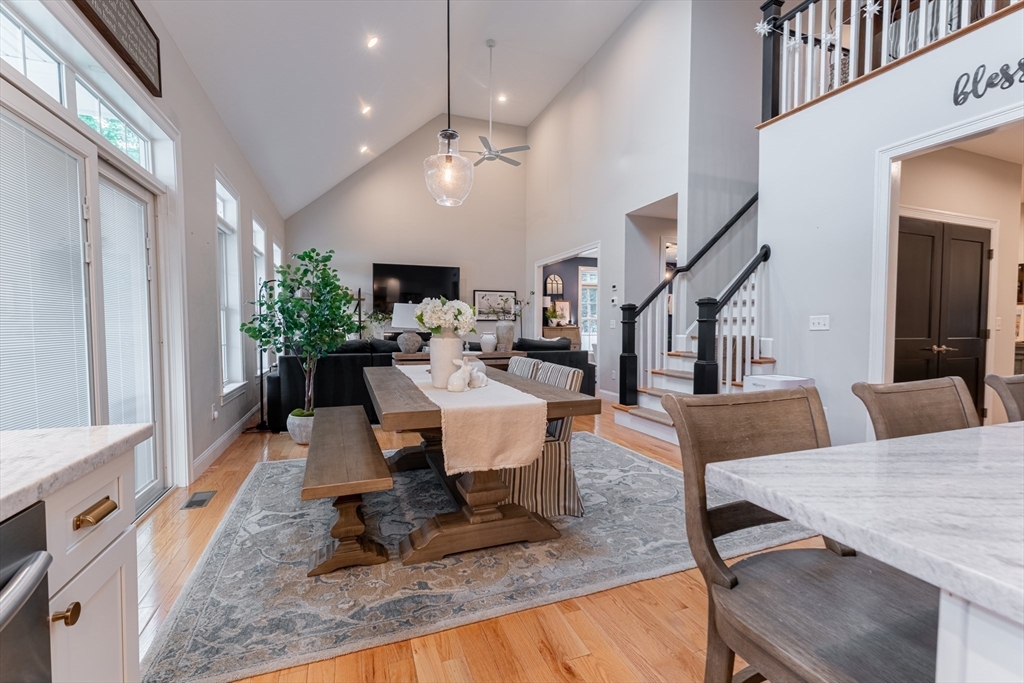 38 Cherry Street, Unit B Hudson, MA 01749 - Photo 7 of 33 a living room with furniture and a chandelier