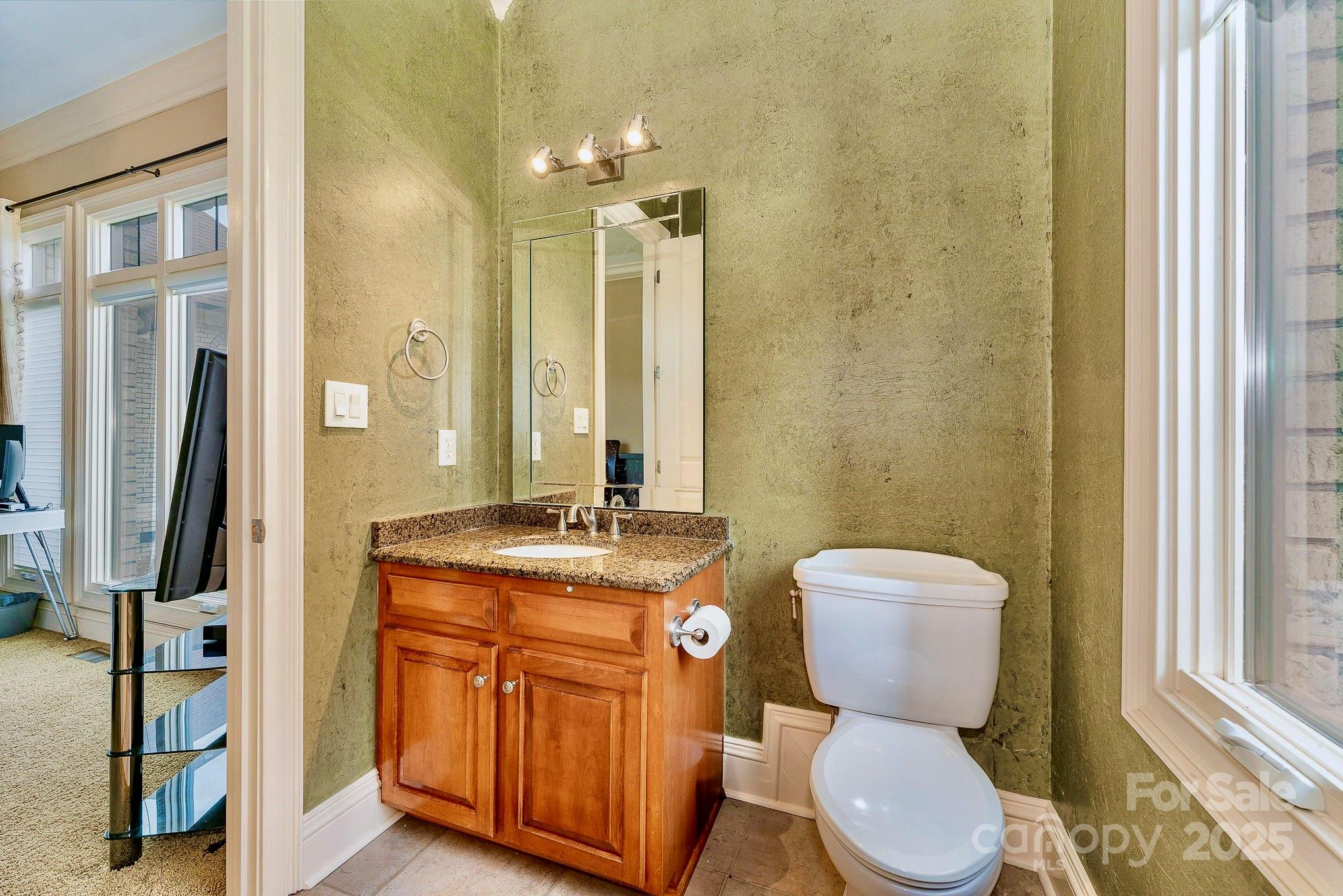 520 Riviera Drive Salisbury, NC 28144 - Photo 22 of 34 a bathroom with a granite countertop toilet sink and mirror